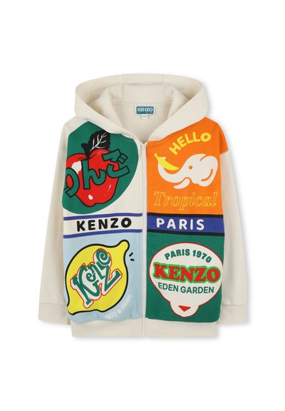 Sweat à capuche crème avec des impressions graphiques multicolores incluant des fruits et du texte. Présente un zip frontal et des couleurs d'accent contrastantes.
