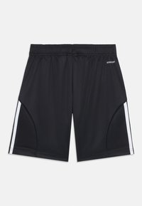 Svarte sportsbukser laget av glatt stoff, har en elastisk midje, sidepaneler og kontrastfargede hvite striper langs sidene.