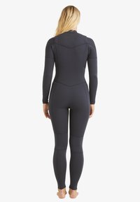 Navy wetsuit made of stretchy neoprene material, featuring long sleeves, a fitted design, and flat seams, providing a streamlined appearance.