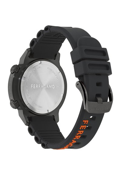 Black rubber watch with a stainless steel back. Features bold orange "FERRAGAMO" lettering on the strap. Multiple adjustment holes and textured band.
