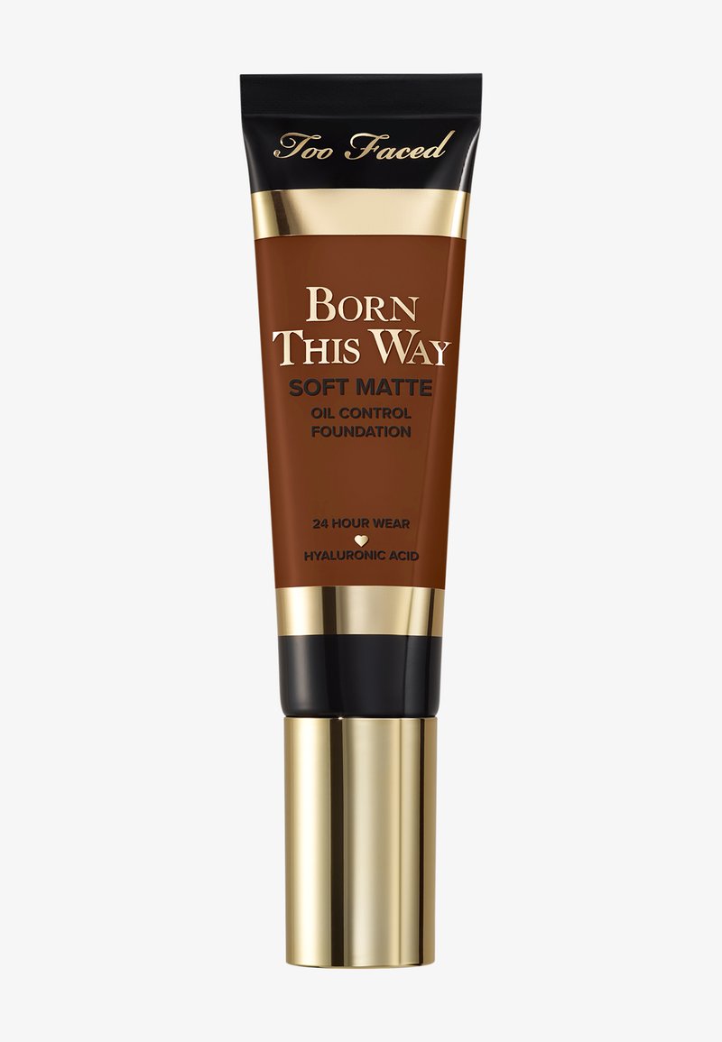 Too Faced Born This Way Soft Matte oil control foundation tube in medium-deep shade with gold and black cap and 24-hour wear text.