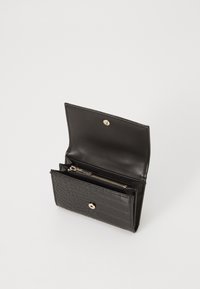 Black leather wallet with crocodile pattern, featuring a snap closure and multiple compartments including a zippered section for coins.