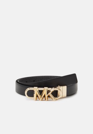 Black leather belt with a gold clasp featuring stylized MK logo, rolled up on a plain light background.