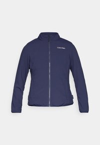 Navy blue zip-up jacket with a stand collar, made from smooth fabric, featuring a Calvin Klein logo on the upper left side.