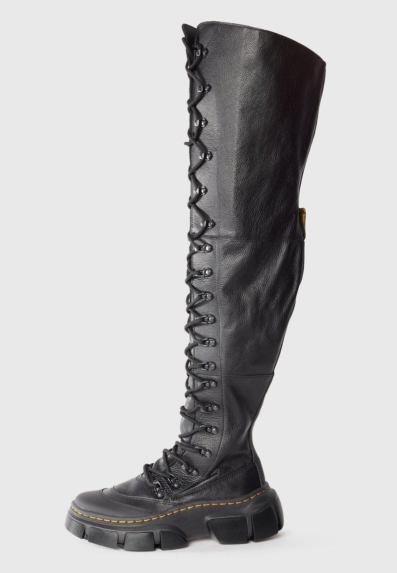 Knee-high black leather lace-up boots with chunky rubber sole, featuring a textured finish and yellow stitching detail.