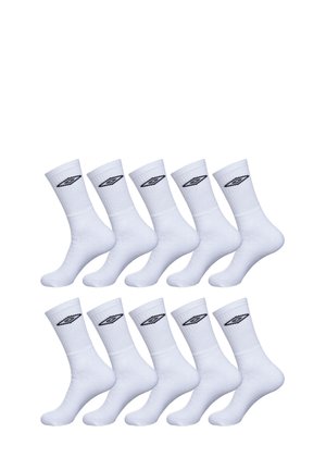 Chaussettes blanches en coton avec un poignet côtelé et un logo noir sur le côté. Paquet de 12 avec une texture douce et une longueur standard de tige.