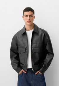 Bershka Faux leather jacket - black