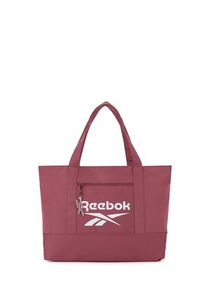 Borsa tote Reebok bordeaux con doppi manici, tasca frontale con zip e logo bianco su sfondo semplice.