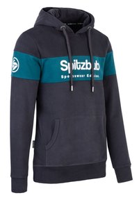 Námořnická modrá mikina s kapucí a tyrkysovým pruhem, na kterém je bíle napsáno "Spitzbub Sportswear Edition". Obsahuje přední kapsu a stahovací kapuci.
