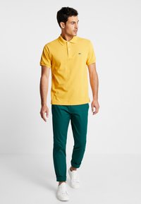 Lacoste Piké - darjali