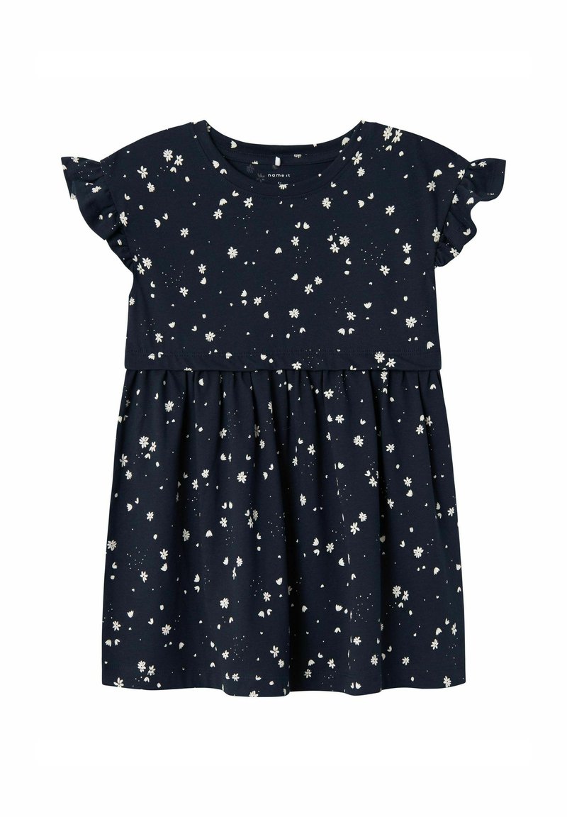 Vestido de algodón azul marino con mangas cortas con volantes, falda acampanada y un estampado floral blanco en toda la prenda. Presenta un escote redondo.