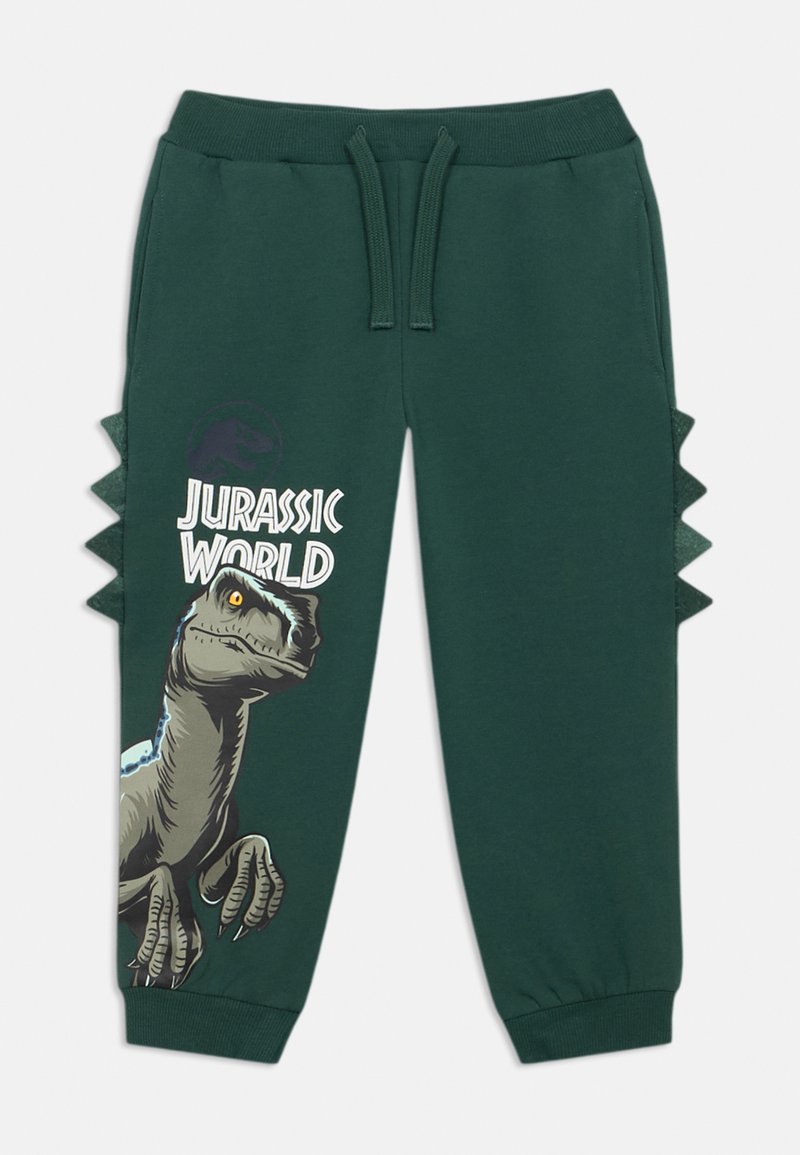 Green sweatpants with elastic waistband, featuring a dinosaur graphic and "Jurassic World" text. Side spikes add a unique design detail.