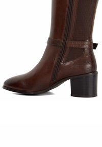 Brown leather knee-high boot featuring a textured panel, side zipper, and a sturdy block heel. Smooth finish with a subtle sheen.