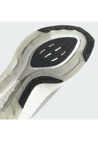 Suola di sneaker bianca con accenti in gomma nera. Scanalature e motivi testurizzati per una migliore aderenza. Presenta il marchio "Continental" sul lato.