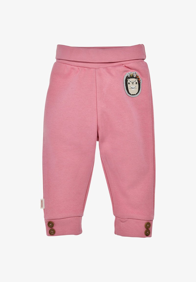 Rosa Baumwollhose für Kinder mit einem breiten elastischen Bund, seitlichem Igel-Patch und braunen Knopf-Accessoires an den Bündchen.