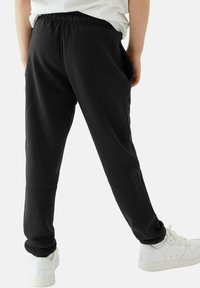 Marks & Spencer 2 PACK UNISEX REGULAR FIT - Pantalon de survêtement - black