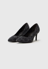 Black high-heeled shoes with a pointed toe design, textured surface covered in small rhinestones, and a slender stiletto heel.