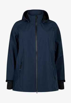 Veste marine avec fermeture éclair à l'avant, capuche amovible et deux poches latérales. Présente une texture lisse et des accents noirs aux poignets et au col.