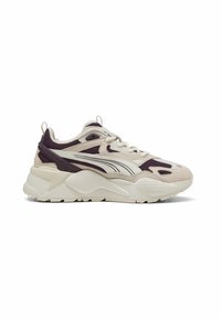 Sneaker with a beige and purple mesh design, featuring rubber sole, padded collar, and prominent white accents on the sides.