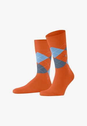 Una coppia di calze arancioni a costine con motivo argyle blu e grigio e accenti di diamanti cuciti in bianco.