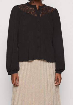 Black button-up blouse with lace detailing on the shoulders, long puffed sleeves, and a slightly cropped hemline. Smooth fabric texture.