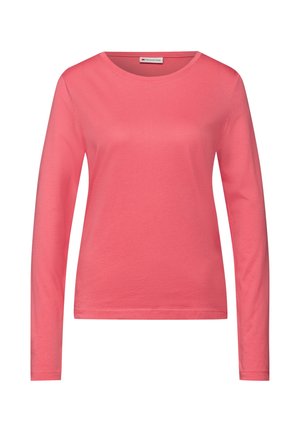 Długi rękaw, koralowy t-shirt wykonany z miękkiej bawełny. Posiada okrągły dekolt i gładką fakturę, z luźnym krojem.