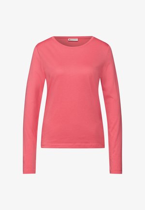 Długi rękaw, koralowy t-shirt wykonany z miękkiej bawełny. Posiada okrągły dekolt i gładką fakturę, z luźnym krojem.