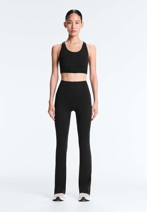 OYSHO HIGH-RISE COMFORT FLARE - Trousers - black
