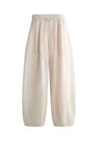 Voľné široké nohavice z béžového ľanu s elastickým pásom a sťahovacou šnúrkou, dĺžka nad členok a malé záhyby pri manžetách.