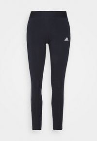 Navy leggings with a fitted design, elastic waistband, and white accent stripes along the sides. Features a small white logo on the front.