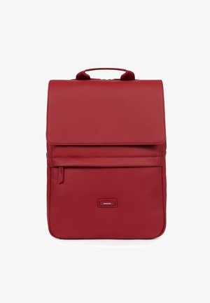 Red leather backpack with a flap closure, top handle, front zip pocket, smooth texture, and logo plate at the front.
