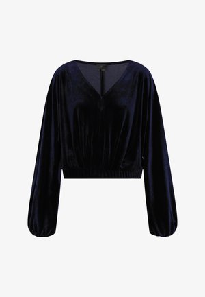 Temno modra skrajšana majica iz mehkega žameta, s globokim V-izrezom, dolgimi napihnjenimi rokavi in prileganjem pasu z diskretnim nabiranjem.