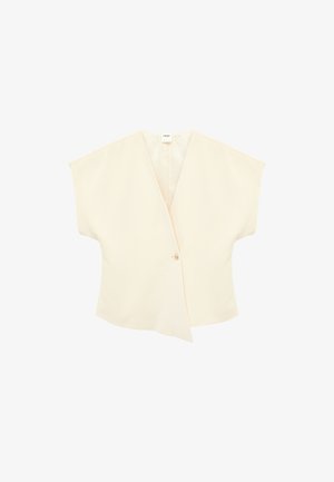Blouse à manches courtes de couleur crème avec un col en V profond et une fermeture à bouton unique à l'avant, présentant un ourlet asymétrique et ample.