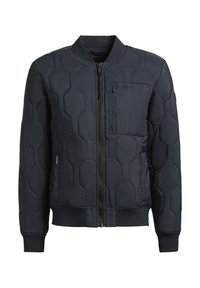 Tengeri kék puffertakaró hexagonális steppeléssel, cipzáros elülső résszel és bordázott mandzsettákkal. Tartalmaz egy mellzsebet és egy karcsú, könnyű dizájnt.