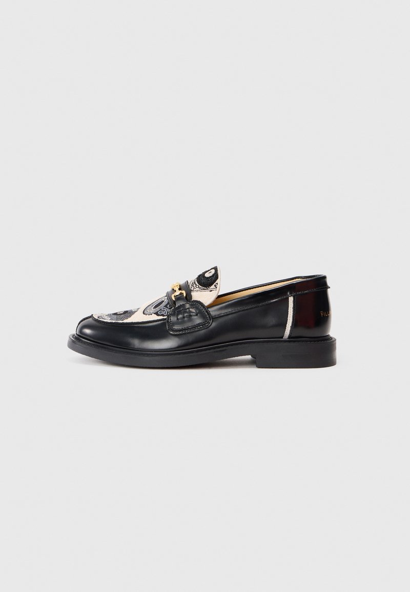 Black leather loafer with white patterned fabric on top and gold-tone horsebit detail, against plain light gray background.
