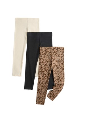 Tre paia di leggings piegati in beige, nero e marrone con motivo maculato nero su sfondo bianco.