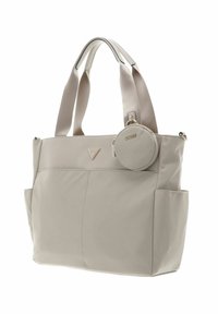 Sac cabas gris clair avec deux poignées supérieures, matériau synthétique lisse, un emblème logo à l'avant et une pochette ronde détachable pour pièces de monnaie.