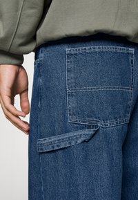 Dr.Denim COLT WORKER - Calças de ganga de corte relaxado - pebble mid stone