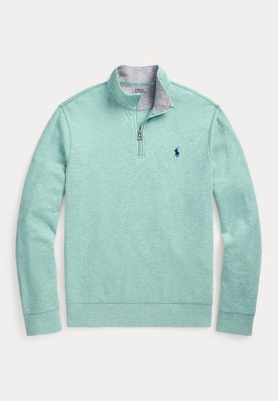 Sweatshirt verde claro com meio fecho e colarinho interior cinzento, com logótipo azul-marinho no peito, feita de tecido macio e texturizado.