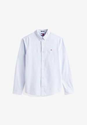 Világoskék gombos ing klasszikus gallérral, hosszú ujjakkal, és egy kis logóval a bal mellen. Pamutból készült, sima textúrával.