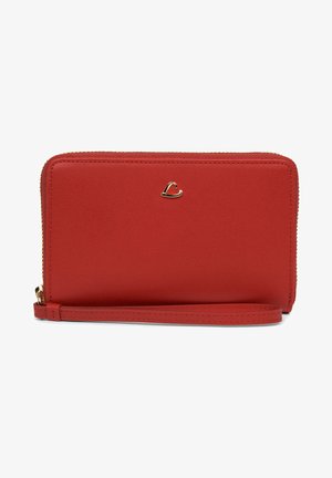 Red leather wallet with a smooth texture, zip closure, and gold-tone logo accent. Features a wrist strap for easy carrying.