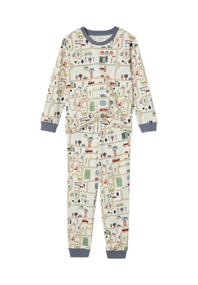 Children's long-sleeve pajamas with a city street map pattern featuring roads, buildings, vehicles, trees, and traffic signs on cream fabric.
