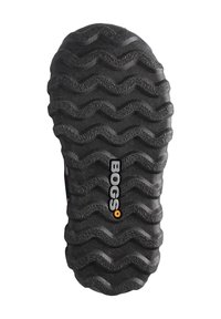 Svart gummisula med ett zigzag-mönster, med ordet "BOGS" i vitt och orange nära mitten. Texturerad yta för bättre grepp.