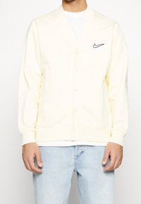 Nike Sportswear Tröja med dragkedja - light yellow