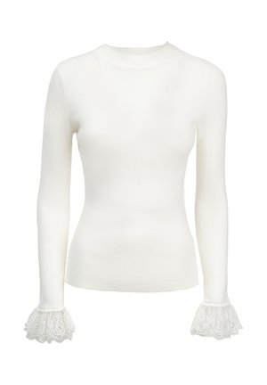 Top bianco a maniche lunghe realizzato in un tessuto morbido, con eleganti dettagli in pizzo sui polsini, che aggiungono texture e particolari al design.