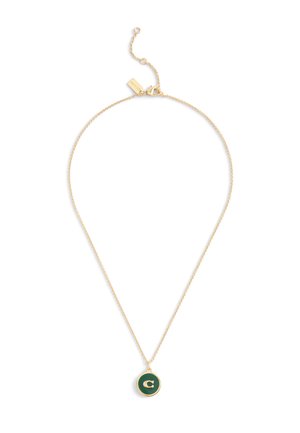 Gold chain necklace featuring a circular pendant with a dark green background and a gold letter "C" in the center.
