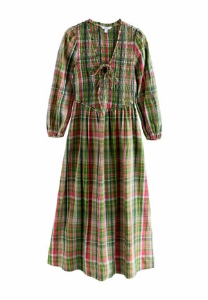 Grünes, rotes und pinkes kariertes Kleid mit langen Ärmeln, gerafftem Oberkörper und einer Schleife am Ausschnitt. Der fließende Rock reicht bis zur Mitte der Wade.