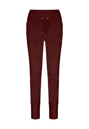 Burgundy jogger pants made from a smooth fabric, featuring a drawstring waist, side pockets, and tapered cuffs.