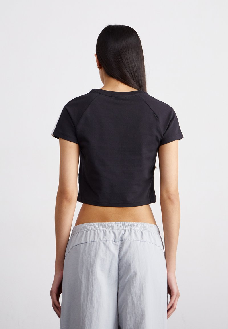 Puma BABY TEE - Triko s potiskem - black