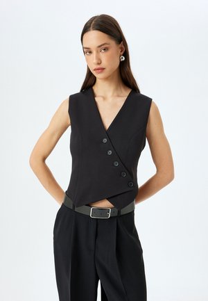 ASYMMETRIC - Waistcoat - black
